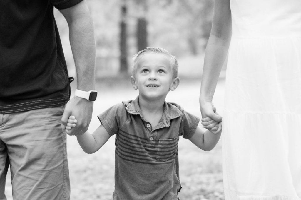 A little boy in a park in Greenville SC during a family and maternity session by Jenny Macy Photography.