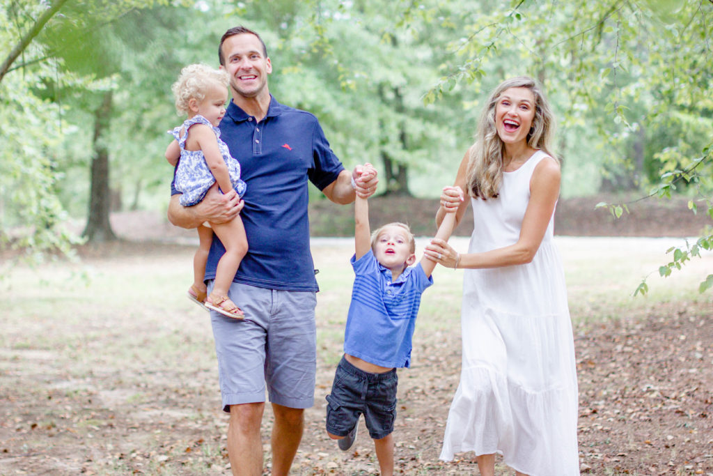 A family in a park in Greenville SC during a family and maternity session by Jenny Macy Photography.