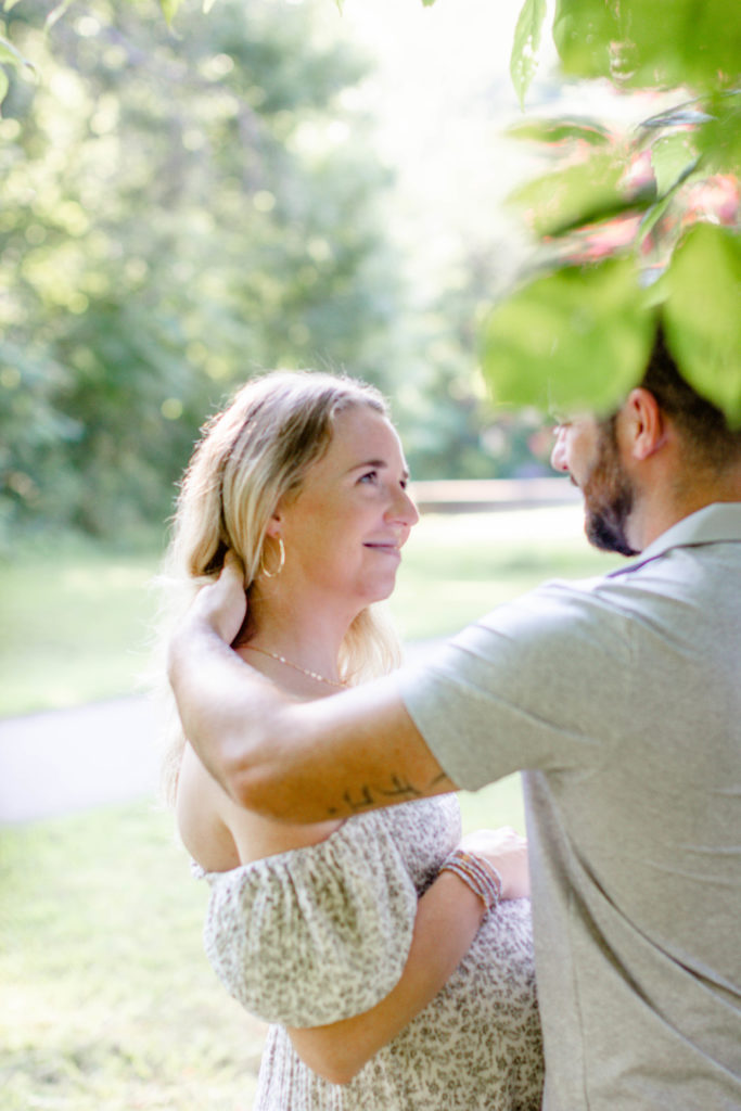 A woman and her husband during a maternity mini session in Greenville, SC by Jenny Macy Photography.