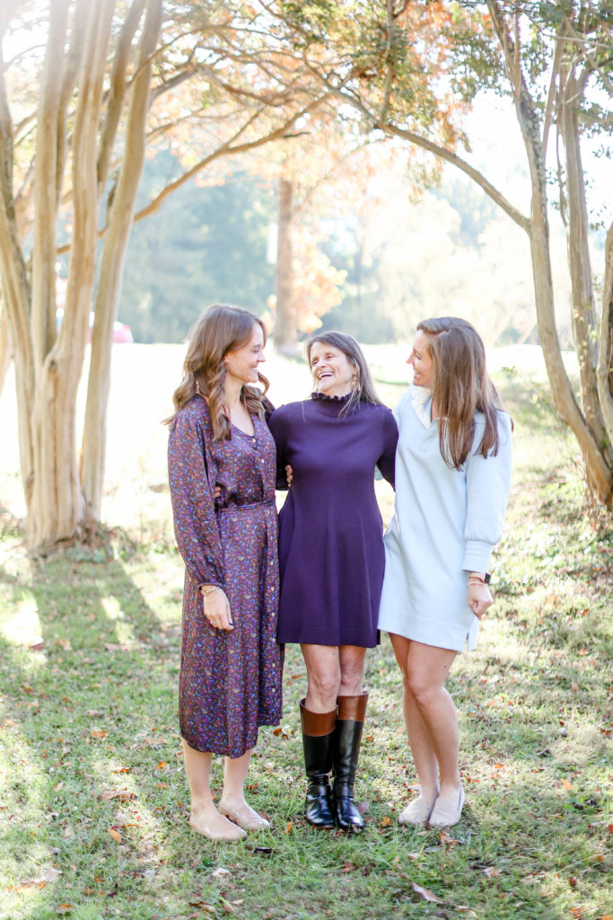 Mother and daughters laughing laughing during a fall family photo session in Greenville, SC with Jenny Macy Photography.