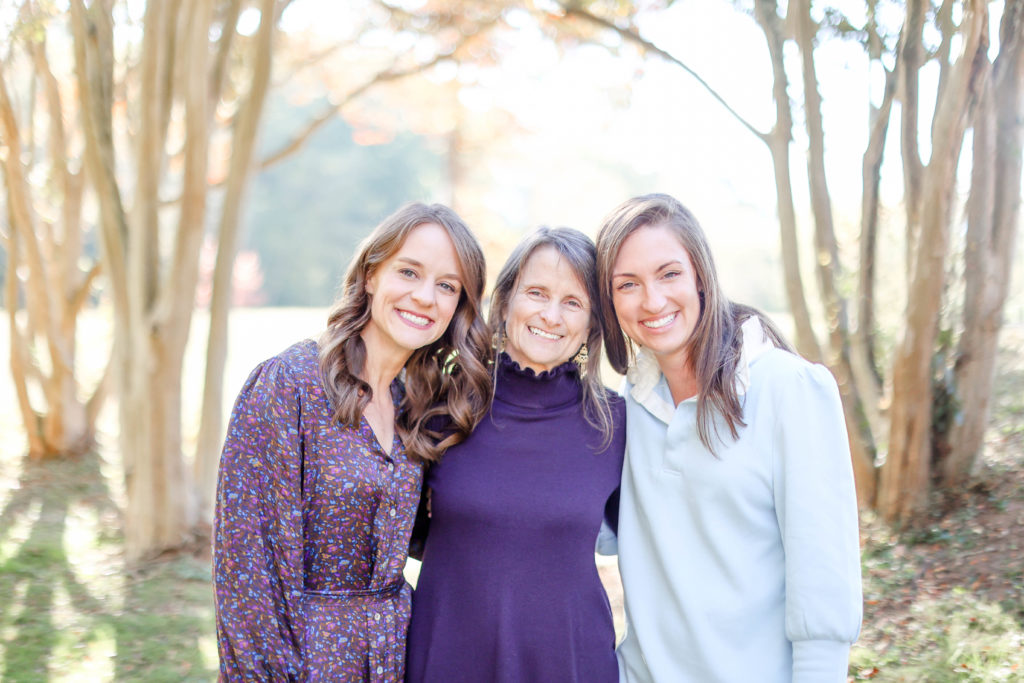 Mother and daughters smiling during a fall family photo session in Greenville, SC with Jenny Macy Photography.
