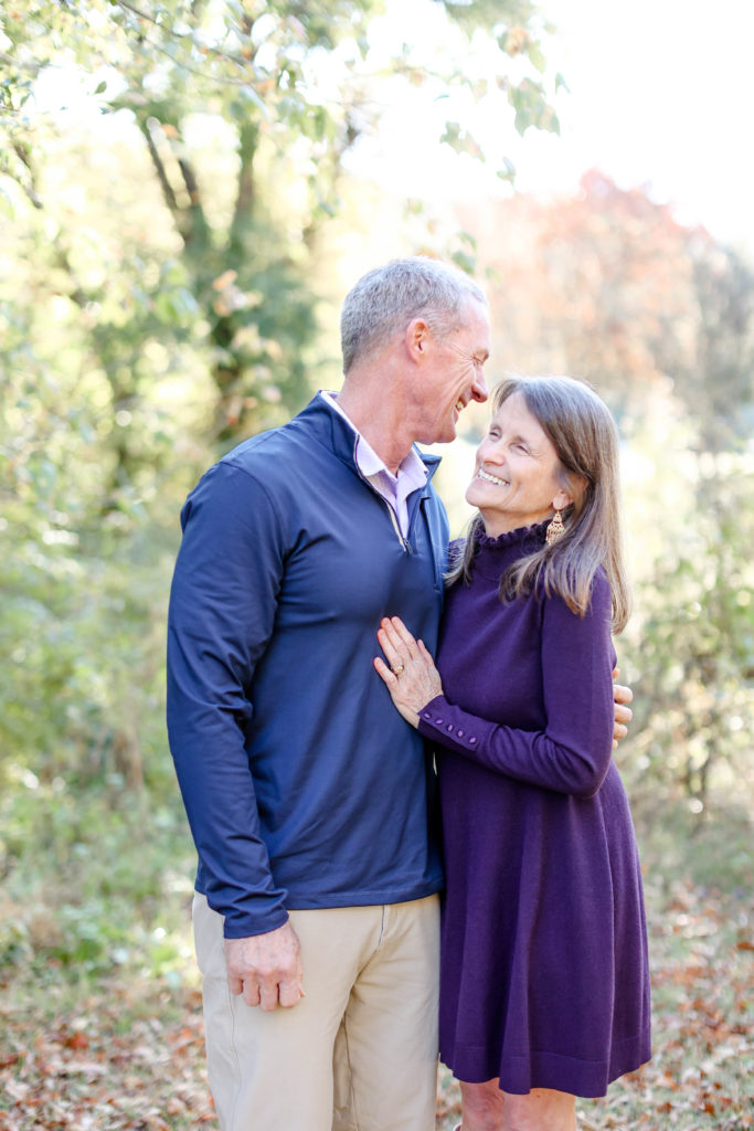 Grandparents laughing during a fall family photo session in Greenville, SC with Jenny Macy Photography.