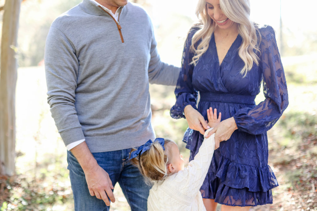 A little girl, her mom and dad during a fall family session in Greenville, SC by Jenny Macy Photography.